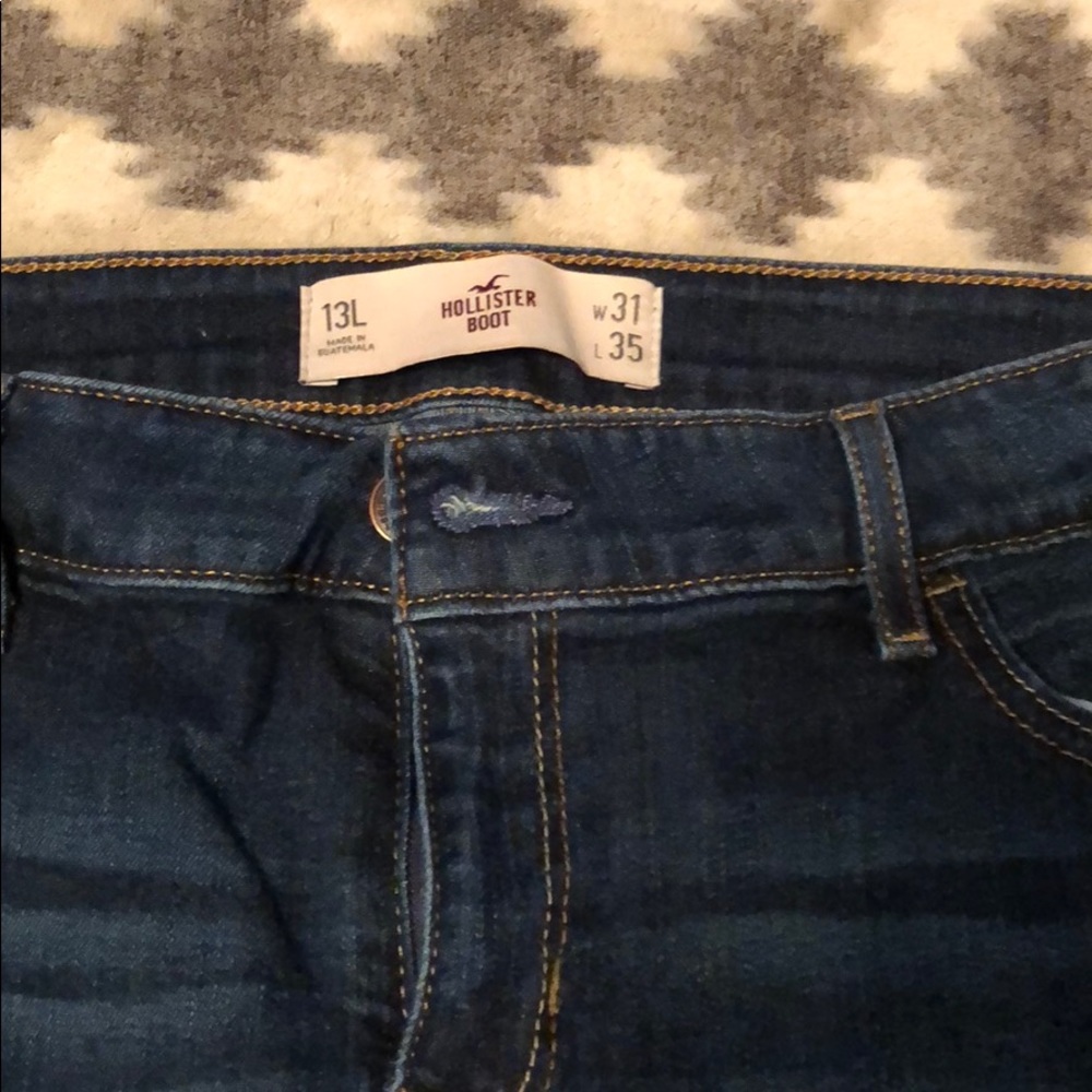 Hollister destroyed low rise boot cut jeans.